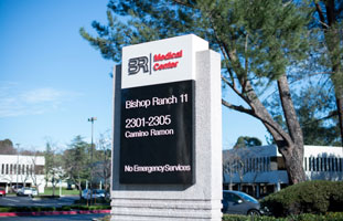 Look for the signs that says Bishop Ranch #11 and or Bishop Ranch Medical Center on the East side of Camino Ramon. The Kaiser building is across the street on the West side of Camino Ramon.